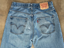 Vintage Levi’s distressed 569 loose straight leg jeans