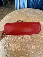 Vintage red leather shoulder bag purse with a top handle and a metal ring detail