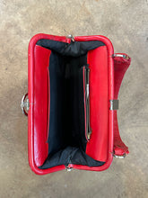 Vintage red leather shoulder bag purse with a top handle and a metal ring detail