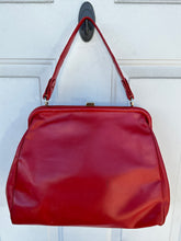 Vintage red leather shoulder bag purse with a top handle and a metal ring detail