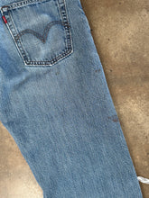 Vintage Levi’s distressed 569 loose straight leg jeans