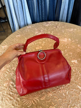 Vintage red leather shoulder bag purse with a top handle and a metal ring detail