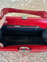 Vintage red leather shoulder bag purse with a top handle and a metal ring detail