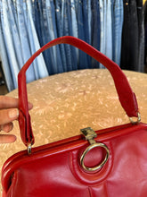Vintage red leather shoulder bag purse with a top handle and a metal ring detail