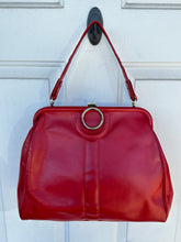 Vintage red leather shoulder bag purse with a top handle and a metal ring detail